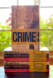 book trilogy wrapped in crime tape