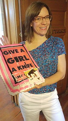 Amy Thielen with cake decorated like her book