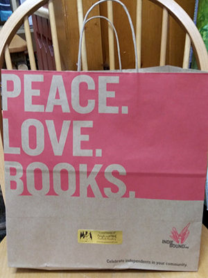 Bag printed with "PEACE. LOVE. BOOKS." 