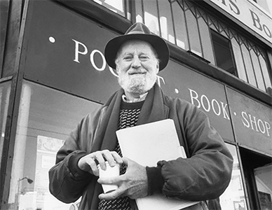 Lawrence Ferlinghetti in front of an independent bookstore