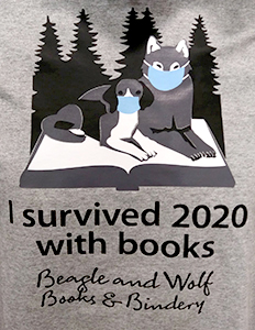 T-shirt with "I survived 2020 with books: Beagle and Wolf Books & Bindery"